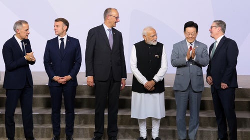 Canada's Prime Minister Mark Carney, France's President Emmanuel Macron, Germany's Chancellor Friedrich Merz, India's Prime Minister Narendra Modi, South Korea's President Lee Jae Myung, and British Prime Minister Keir Starmer stand as leaders pose for a group photo, on the opening day of the G20 Leaders' Summit, in Johannesburg, South Africa, Saturday, Nov. 22, 2025. 