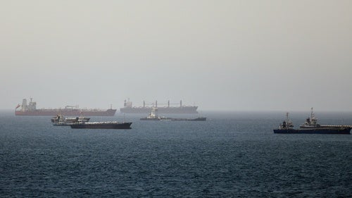 Tankers and cargo vessels are seen in the Gulf of Oman, along shipping routes linking the Strait of Hormuz and the Arabian Sea, Tuesday, June 16, 2026.