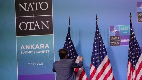 A member of protocol arranges U.S. flags prior to a media conference at the NATO summit in Ankara, Turkey, Wednesday, July 8, 2026. 