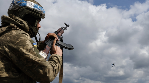 A Ukrainian serviceman shoots towards a drone during training at the polygon, in Zaporizhzhia region, Ukraine.