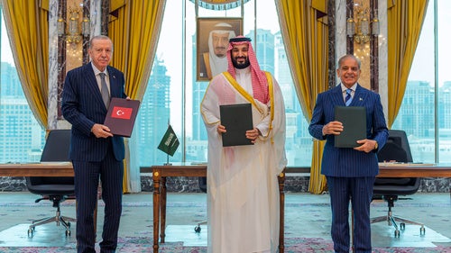 Turkish President Recep Tayyip Erdogan, Saudi Crown Prince Mohammed bin Salman and Pakistani Prime Minister Shehbaz Sharif pose after signing a trilateral defense agreement in Mecca, Saudi Arabia, Friday, Aug. 7, 2026. 