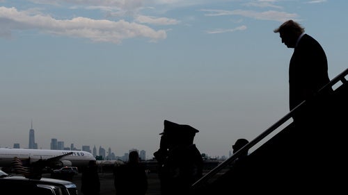 President Donald Trump disembarks Air Force One at Newark Liberty International Airport, New York seen in the background, Friday, Aug. 7, 2026, in Newark, N.J. 