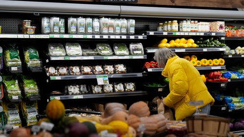 A shopper looks at produce at a grocery store Tuesday, Feb. 10, 2026, in Chicago.