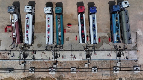 Road tankers are filled with gasoline unloaded from ships anchored offshore and held in storage tanks at the Baniyas Oil Terminal in Tartous province, Syria, Tuesday, Sept. 29, 2026.