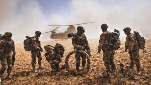 Soldiers of the 82nd Airborne Division gather their equipment before boarding a CH-47F Chinook in the Nawa Valley, Kandahar Province, Afghanistan.
