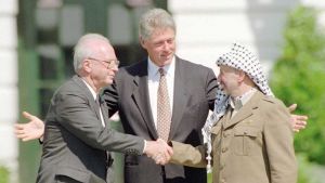 Israeli Prime Minister Yitzhak Rabin, U.S. president Bill Clinton, and PLO chairman Yasser Arafat.