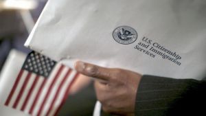 US Citizenship and Immigration Services envelop and US flag