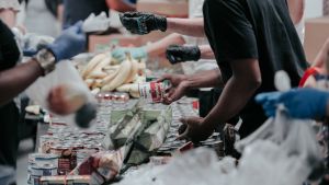 People shop at a community food bank