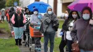 People queue to pick up fresh food at a Los Angeles Regional Food Bank, as the spread of the coronavirus disease (COVID-19) continues