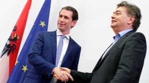 Head of Austria's Green Party Werner Kogler and Head of Peoples Party (OeVP) Sebastian Kurz shake hands after delivering a statement, as they start their negotiations for a coalition government in Vienna, Austria