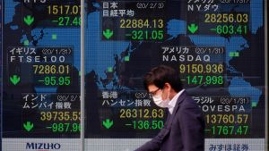 A monitor shows the Nikkei stock average rate and others falling in Osaka, Japan on February 3, 2020.