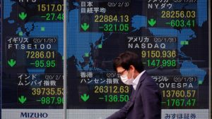 A monitor shows the Nikkei stock average rate and others falling in Osaka, Japan on February 3, 2020.