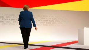 German Chancellor Angela Merkel walking away from camera