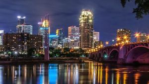 Minneapolis skyline and bridge seen from across the river. 