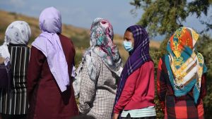 A group of migrant women in Greece wearing masks during the COVID-19 pandemic.