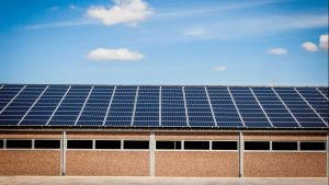 Solar panels on top of a warehouse