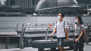 Tourists wearing masks during COVID 19 pandemic in Singapore.