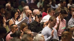  Candidates taking the Oath of Allegiance at a Naturalization Ceremony at College of DuPage