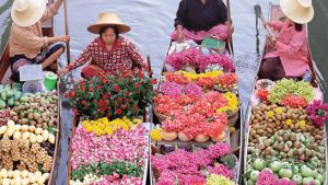 Women with crops in boats. 