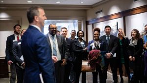 A group of Emerging Leaders meeting EL alumnus and US Congressman Sean Casten.