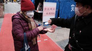 A person gets their temperature checked during the COVID-19 pandemic in Beijing