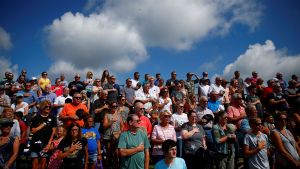 People in Iowa stand for the national anthem