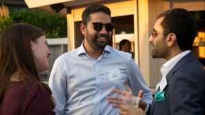 Three members of the Council's Young Professionals Network talk during the annual summer party.