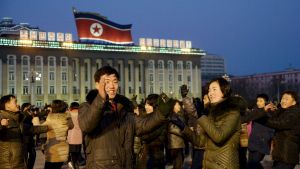 North Koreans dance to celebrate what the country claims was a "successful hydrogen bomb" test at Kim Il Sung square in Pyongyang