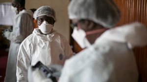 Sierra Leonean doctors practice wearing protective clothing in the Ebola Training Academy in Freetown