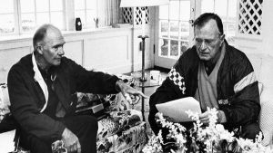 President George H. W. Bush receives his morning briefing from national security adviser Brent Scowcroft while on vacation in Kennebunkport, Maine.