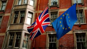 The Union Jack and the European flag on a building of London.