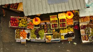 An aerial view of produce stands at a street market