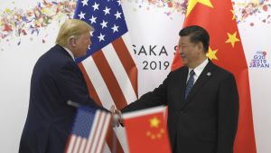 President Donald Trump and China President Xi Jinping shake hands