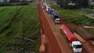 Parked trucks wait in 10km queue to cross the Kenyan-Ugandan border from the town of Busia