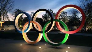 Illuminated Olympic rings are displayed before the new national stadium