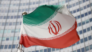 The Iranian flag waves in front of the International Atomic Energy Agency (IAEA) headquarters