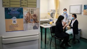 People sit in a doctor's office 