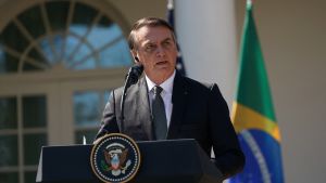 A man stands and speaks at a podium