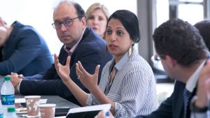 Executives engaging in conversation during an event