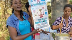 A woman gives mothers a lesson in nutrition