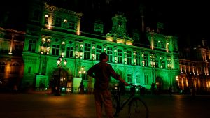 Green lights are projected onto the facade of the Hotel de Ville in Paris, France, after U.S. President Donald Trump announced his decision that the United States will withdraw from the Paris Climate Agreement