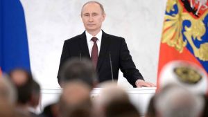 Vladimir Putin speaking in front of a crowd