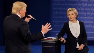 Democratic presidential nominee Hillary Clinton listens to Republican presidential nominee Donald Trump during the second presidential debate at Washington University in St. Louis