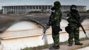 Brazilian army soldiers wearing chemical suits