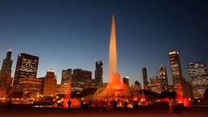 Buckingham Fountain in front of Chicago skyline at night