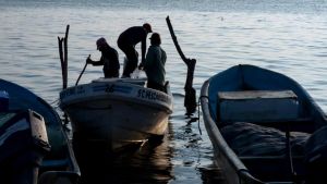 Migrant boats stop at fishing villages to refill petrol tanks.