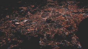 Aerial view of a city lit up at night