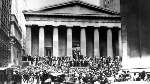 People gather outside of the Wall Street Stock Exchange