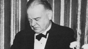A black and white photo of Herbert Hoover in a tuxedo.