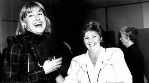Black and white photo of two women laughing